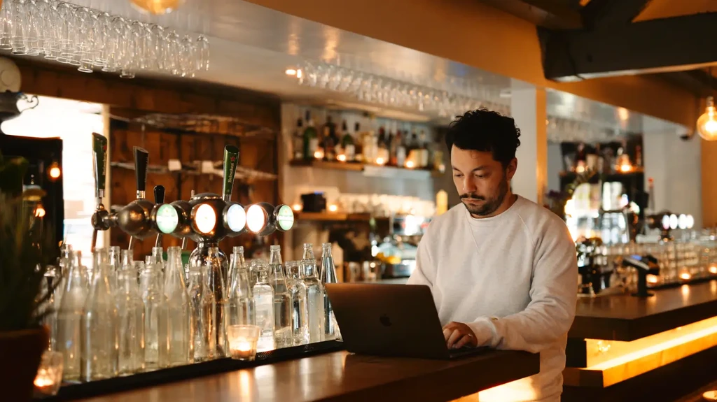 Eventplanner working at the bar at event venue Vergulden Eenhoorn Amsterdam